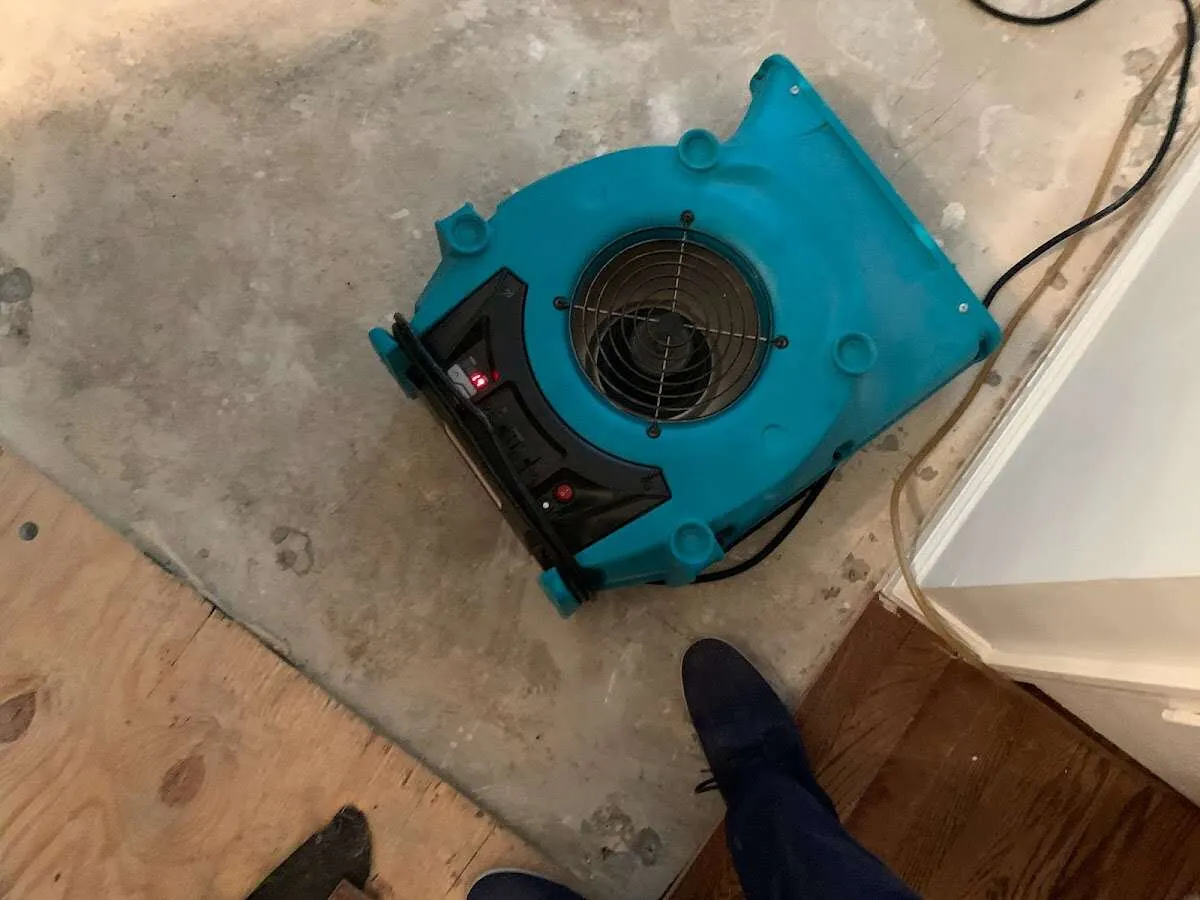 Air mover drying subfloor during Leak Detection & Repair in Four Corners